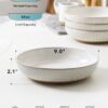 A stack of four LE TAUCI large pasta bowls showing their space-saving, stackable design for kitchen storage.
