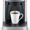 Detail shot of the Breville thermal carafe and gold tone filter included with the Grind Control coffee maker.