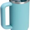 The Stanley Quencher flip straw tumbler placed in a car cup holder for convenient travel.
