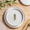 Stackable ceramic bowls and plates from TheTerra, demonstrating a space-saving kitchen storage solution.