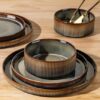 Modern ceramic dinnerware set for 4 beautifully arranged on a dining table with natural tones for elegant dining.