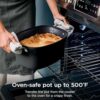 Action shot of a chef using the included multi-functional utensil to serve food from the pot