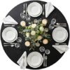 Detail view of the scratch-resistant black wood grain texture on the NUTIKAS dining table top.