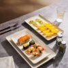 Famiware serving platters set arranged on a dining table to showcase the wave design