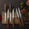 Dining table setting featuring the serrated steak knife set for a sophisticated meal experience