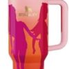 Barbie Stanley tumbler 40oz shown in a car cupholder to highlight its travel-friendly design.