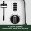 Close-up of the extra-lift carriage lever on the Cuisinart 4 slice toaster for easy bread removal.