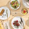 High-angle shot of the lead-free ceramic dinnerware set for 4 arranged on a minimalist dining table.