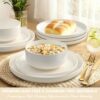 The Umite Chef 12-piece stoneware dinnerware set displayed on a modern dining table.