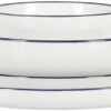 Flat lay of the Gibson Home Oslo porcelain dinnerware set including dinner plates, dessert plates, and bowls