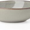 Top-down view of the 12-piece gray stoneware dinnerware set featuring unique artisanal details.
