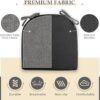 Wiping clean a dark gray Wellsin indoor seat cushion with a damp cloth