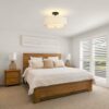 Lit dining room ceiling light casting a warm, charming ambiance through its dual fabric shades