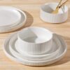 A detailed look at the smooth texture and artisan-crafted rim of a TheTerra dinner plate.