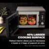 Showing the spacious flatbed interior fitting a large baking dish in the Ninja microwave air fryer