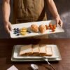 Professional kitchen flat lay featuring the Famiware 3-piece stoneware serving platters set