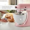 Professional home cook using the KitchenAid ice cream maker attachment to create frozen sorbet.