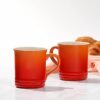 Detailed angle showing the ergonomic handle and premium finish of the Le Creuset stoneware mug.