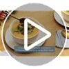Non-toxic, lead-free Pure Living 16 piece stoneware dinnerware set presented in a minimalist table setting.