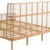 Low angle shot showcasing the airy design of the Lamar boho rattan king bed and its 800 lb weight capacity.