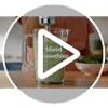 In-use shot of the KitchenAid Go cordless hand blender blending a smoothie in the included pitcher