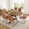 Full dining room display of the extendable round dining set fully assembled with six upholstered chairs
