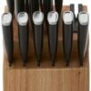 KitchenAid cutlery set with ergonomic handles arranged neatly in the natural wood storage block