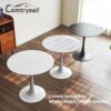 Elegant interior design view of the round tulip dining table serving as a statement piece in a dining area