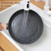 The Anymark non-stick ceramic cookware set neatly arranged to showcase all included pots, pans, and utensils.