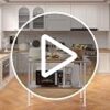 A clean home kitchen setup featuring the Atelicf stainless steel prep table with backsplash.