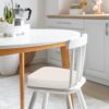 Set of six Iristykilin waterproof dining chair cushions stacked to show thickness and quality
