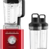 KitchenAid power blender system arranged with all included accessories and jars for a complete kitchen setup.